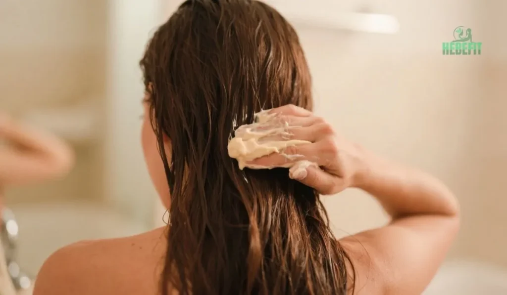 Woman applying natural hair mask